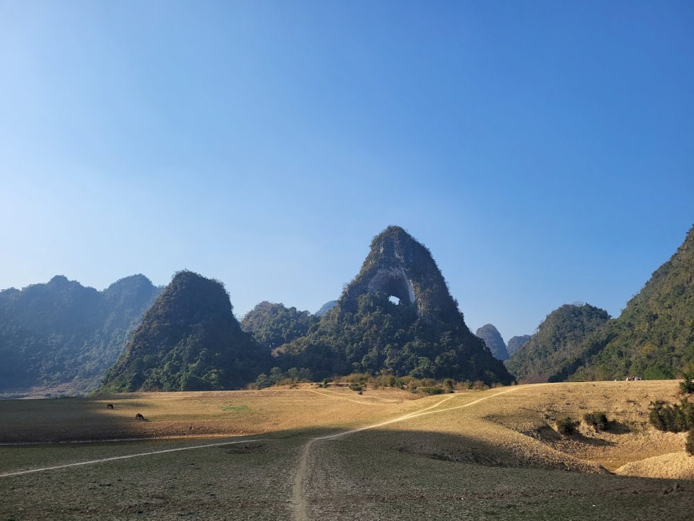 The journey to Nui Thung is a rewarding experience, offering scenic views of lush green meadows and rolling hills
